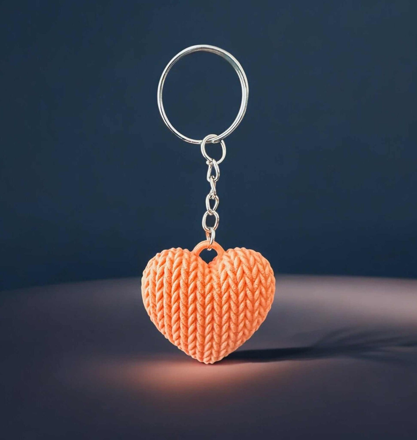 Heart-shaped knitted keychain with realistic texture, 3D printed for durability and charm, adds love and warmth to accessories.