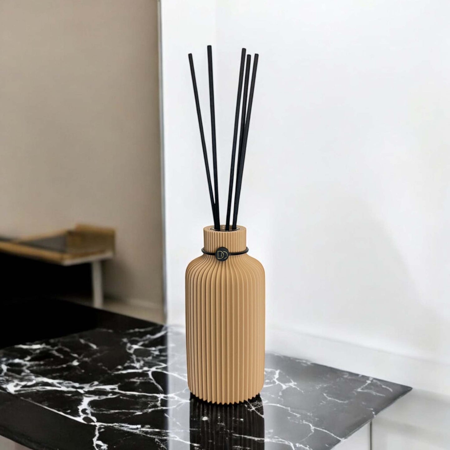 Elegant minimalist diffuser, 3D printed, on marble surface.