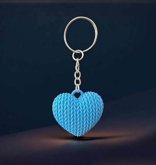 Heart-shaped blue knitted keychain with realistic texture on a metal ring.