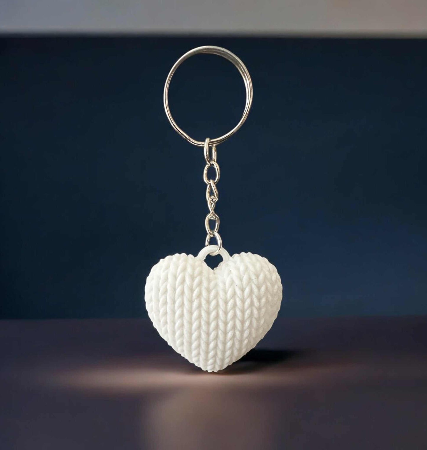 Heart-shaped knitted keychain with a realistic texture, adding warmth and style; perfect for keys, bags, or gifts.