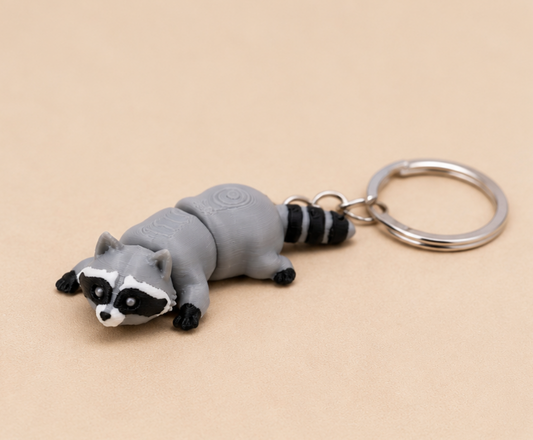 Porte-clé raton laveur articulé miniature en 3D, design original et fabrication artisanale française.