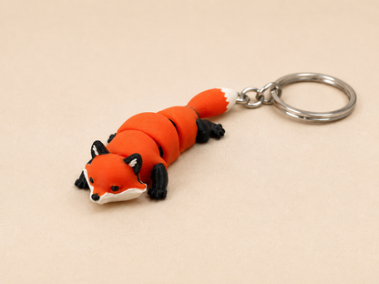 Porte-clé renard articulé imprimé 3D, accessoire léger et original pour clés, sac ou bureau.